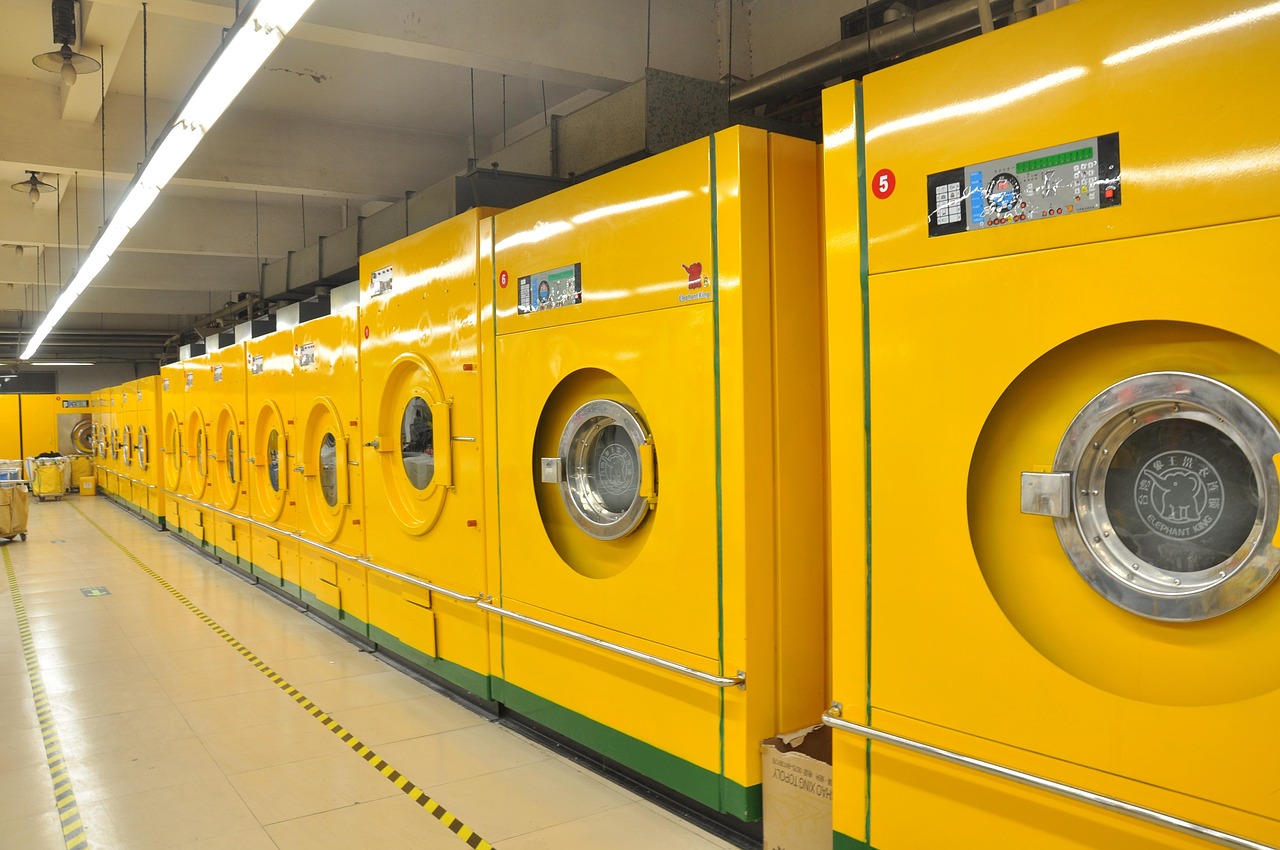 Waar vind je de aan- en uitknop van de Miele W1 Excellence?